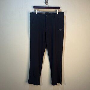 Oakley Golf Men's jet black flat front Tech chino Pants 34 X 32 EUC